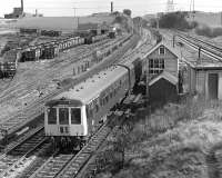 The 10.41 Leeds to Sheffield via Barnsley service passes Lockes Sidings box shortly after pulling away from the Normanton stop in 1976. The normal fare on this sevice at the time was a single Lincoln-based class 114 dmu set but strengthening was obviously implemented on Saturdays. <br><br>[Bill Jamieson 03/04/1976]
