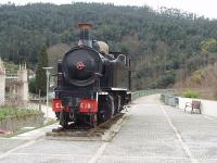 A sweeping former narrow gauge line viaduct is a notable feature striding high over the Portuguese town of Vouzela. The line finally formally closed in 1990 and the bridge is now open to foot passengers with a metre gauge Henschel 2-4-6-0T Mallet, No. E202 (The E denotes narrow gauge), displayed at the end. Whilst static locos like this are not preserved in ideal circumstances E202 has fared better than sister loco E213 at Pocinho on the closed Sabor line [See image 37992] and her many scrapped classmates.<br><br>[Mark Bartlett 07/02/2007]