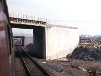 Construction work in progress on the Forth Road Bridge approach roads to the north of Inverkeithing, taken from a Perth-bound train on 23rd March 1963.<br><br>[Frank Spaven Collection (Courtesy David Spaven) 23/03/1963]