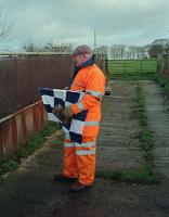 While his colleagues work to the north of Dalrymple Junction on the double track section this gentleman looks after their safety from a farm access bridge just north of the junction. This 1993 view looks east with the track running below from left to right.<br><br>[Ewan Crawford /12/1993]