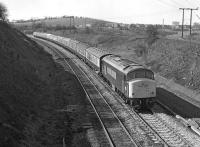 The Saturday 06.55 Gloucester - Leeds on the former Midland mainline half a mile south of Goose Hill Junction in April 1976. 45071 was the first the of the class to run without a headcode panel (following accident repairs carried out in 1975) in anticipation of reporting numbers no longer being displayed, a policy implemented from early in 1976.<br><br>[Bill Jamieson 03/04/1976]