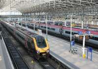 Platform 7 at Manchester Piccadilly sees Cross Country Voyager 221117 awaiting departure for Bristol Temple Meads. In Platform 5 a Pendolino is on a Euston service, which these days run at 20 minute intervals from here. <br><br>[Mark Bartlett 23/03/2012]