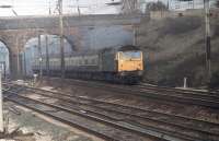 47424 leads a Preston to Liverpool service on the Up Fast at Farington Curve Junction in January 1981. The former D1531 lasted exactly ten more years in traffic before withdrawal from Crewe in January 1991 and a further three in limbo before cutting at Booths, Rotherham in January 1994.  <br><br>[Mark Bartlett 05/01/1981]