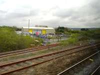 The mothballed Gwendraeth Valley line turning north from the end of the exchange sidings to the east of Kidwelly Station in April 2012. <br><br>[David Pesterfield 19/04/2012]