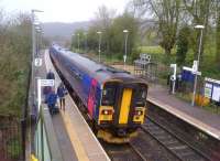 A 158+153 combination restarts from the village station at Freshford, south of Bath, on 7 April 2012. The passengers may be a bit bedraggled due to the drizzle, but the award winning station gardens - so rare today - are clearly visible over the train roof.<br><br>[Ken Strachan 07/04/2012]