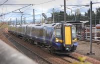 380 103 passes the fuelling point at Craigentinny depot with the 13.27 from North Berwick to Edinburgh on 24 April 2012.<br><br>[Bill Roberton 24/04/2012]