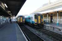 The long platforms at Tenby see two very short trains passing as 153320 waits for 153362 to clear the single line section from Whitland. In addition to these local services this long branch line still sees summer HSTs as well as regular long distance services to Manchester Piccadilly via Cardiff.<br><br>[Mark Bartlett 23/03/2012]