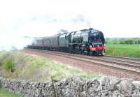 After a stop at Appleby to take on water, no 46233 is seen passing through Smardale on 26 April with the <I>'Great Britain V'</I> on the journey to Preston.<br><br>[Jim Peebles 26/04/2012]