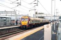 A westbound train from Edinburgh, ultimate destination Milngavie, pulls into platform 2 at Bathgate on 17 April 2012.<br><br>[John Furnevel 17/04/2012]