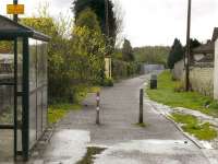 View south from the former level crossing over Auchterderran Road, Lochgelly, in April 2012. The footpath follows the trackbed of the Lochgelly Iron & Coal Co/NCB mineral railway which ran to the Jenny Gray Colliery (closed 1959). Connection was made to the Fife Circle east of Lochgelly Station by means of a rope-worked incline.<br><br>[Bill Roberton 26/04/2012]