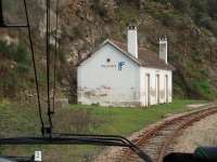 <I>A remote curiosity</I>.  Not only was Tralhariz station bricked up in March 2008, but there was no visible access - with its back to the steep hillside, the front facing the river gorge and not a sign of habitation anywhere. Needless to say the narrow gauge railbus for Tua rumbled through without stopping. The station and line both closed later that same year.<br><br>[Mark Bartlett 18/03/2008]