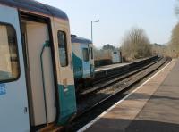 Looking back up the gradient towards Sugar Loaf from Llanwrtyd station where two single car units are crossing. They will also exchange train crews here before departures for Shrewsbury and Swansea. <br><br>[Mark Bartlett 24/03/2012]