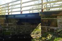 Refurbished bridge over the Mill Burn just west of Castle Douglas in April 2012. This section of the trackbed of the former Kirkcudbright Railway now carries a footpath.<br><br>[Colin Miller 01/04/2012]