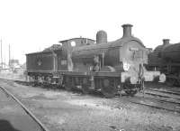 Tonbridge shed in August 1961 with Wainwright 'C' class 0-6-0 no 31592 stabled in the yard.<br><br>[K A Gray 20/08/1961]