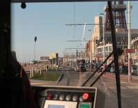 View over the shoulder of the driver of a new <I>Flexity</I> tram on Blackpool Promenade on Day 2 of the new services. It is a warm spring evening and a sister unit is heading for Starr Gate as this Fleetwood bound tram approaches the Tower. Some of the recent improvements to the promenade can also be seen.  <br><br>[Mark Bartlett 05/04/2012]