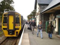 158836 on the rear of the 25 minute late 16.13 service to Aberystwyth and Pwllheli offloads a large number of passengers at Caersws on 13 April. The Aberystwyth portion was to turn back at Machynlleth, with bussing from and to Aberystwyth, to put the return service back on time. The catering trolley was also off-loaded to await the opposing working heading back to Shrewsbury and Birmingham International. <br><br>[David Pesterfield 13/04/2012]