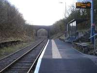 Platform view south at Sugar Loaf Halt in April 2012. The station is in a deep cutting with 24 steps to reach road level. Despite its remote location it has been provided with one of the C.I.S. displays which are currently being rolled out at stations along the Heart of Wales line. [See image 43677]<br>
<br>
 <br><br>[David Pesterfield 11/04/2012]