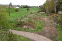 Looking north at the possible site of Sheriffhall station (closed 1849) from the A6106 road bridge by Melville Gate to Old Sheriffhall Farm. The original Waverley Route trackbed disappears into the birch trees at right, while in the middle is marked out the course of the new Borders Railway.<br><br>[Bill Roberton 05/05/2012]