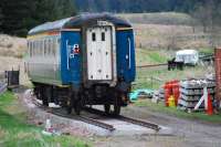 The buffet reaches the Golden Bridge at Whitrope Siding. This coach came north by low loader [see image 38431]. The view looks north with the former signalbox and siding beyond the caravan to the right.<br><br>[Ewan Crawford 01/05/2012]