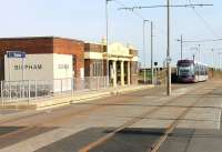 The traditionally styled Bispham Station building still stands alongside the Blackpool and Fleetwood Tramway although a new level access platform has been grafted onto the front. This image of Tram 006 leaving for Fleetwood Ferry was taken from the new staggered Blackpool bound platform. <br><br>[Mark Bartlett 06/05/2012]