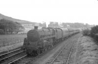 BR Standard class 5 4-6-0 no 73124 has just passed West Kilbride signal box with a Largs branch train in the summer of 1963.<br><br>[R Sillitto/A Renfrew Collection (Courtesy Bruce McCartney) /07/1963]