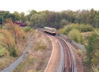 The 13.41 Alloa - Glasgow Queen Street just a few minutes into its journey on 9 May seen shortly after passing the pedestrian footbridge at Alloa West.<br><br>[John Furnevel 09/05/2012]