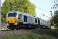 HM The Queen visited Lancashire on 16th May as part of her Diamond Jubilee UK tour. 67026 <I>Diamond Jubilee,</I> in a special silver livery, lifts the Royal Train up the bank at Lancaster with 67006 out of sight bringing up the rear. <br><br>[Mark Bartlett 16/05/2012]