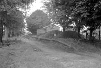 Remains of Bentworth and Lasham station on the Alton - Basingstoke branch in Hampshire. The station closed to passengers in 1932 with the branch closing completely in 1936. The following year the Will Hay comedy <I>'Oh, Mister Porter!'</I> was filmed on the abandoned branch, with nearby Cliddesden representing the fictional <I>'Buggleskelly'</I> station.<br><br>[John Thorn //]