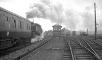 BR Standard class 4 2-6-4T no 80001 caught giving a helping hand to the 9.30am Manchester - Glasgow Central at Beattock North on 29 March 1964. [See image 31907]<br><br>[K A Gray 29/03/1964]
