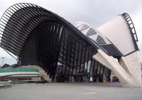 The airport station, Lyon Saint Exupry, built in 1994, poised for takeoff. A few hardy travellers take refuge from the howling gale.<br><br>[Andrew Wilson 25/04/2012]