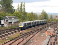 The 14.28 Dunblane - Edinburgh Waverley approaching Stirling on 9 May 2012 past Stirling North signal box. <br><br>[John Furnevel 09/05/2012]