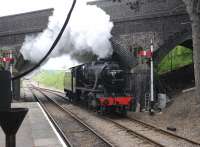 Scene at Winchcombe on 6 May 2012, with 'Turkish' Stanier 8F - seen here as LMS 8274 - in the process of running round its train.<br><br>[Peter Todd 06/05/2012]