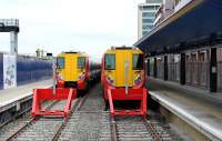 A pair of Southern emu's wait at the Gatwick platforms at Reading station on 17 May 2012.<br><br>[Peter Todd 17/05/2012]