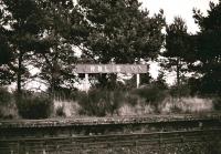 Remains at Orbliston in January 1979, some 15 years after closure, with the station nameboard still standing proud.<br><br>[Peter Todd 18/01/1979]