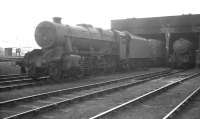 The locomotive shed at Widnes in April 1962 with Stanier 2-8-0 no 48709 in residence.<br><br>[K A Gray 15/04/1962]