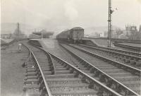 Looking east towards Dumbarton Central in the spring of 1958. V1 2-6-2T 67613 is leaving with a Bridgeton - Helensburgh train.<br><br>[G H Robin collection by courtesy of the Mitchell Library, Glasgow 12/04/1958]