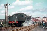 <I>'The Bosworth'</I> pictured during a photostop at the closed station of Worthington, Leics, on 10 April 1965, with Cloud Hill Quarry visible in the background. The special, organised by 'The Railway Enthusiasts Club', ran from Market Harborough and was hauled throughout by BR Standard class 2 2-6-0 no 78028. (For the gourmets - the catering menu on the tour included sausage & beetroot sandwiches at 6d and bottles of Watney's Pale Ale at 1/3d).<br><br>[Andy Carr Collection 10/04/1965]