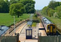 Many trains pass Salwick but few actually stop. Here a Northern Class 158 is seen on a Blackpool - York service as a First Trans Pennine unit appears on the left on its way from Manchester Airport to Blackpool.<br><br>[John McIntyre 22/05/2012]