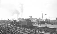 Cross platform view at Manchester Victoria on 4 August 1968 with Britannia Pacific no 70013 <I>Oliver Cromwell</I> + Black 5 no 44781 present in connection with the LCGB <I>'Farewell to Steam'</I> rail tour [aka the <I>'Last Day of Steam Rail Tour'</I>]. [See image 34377]<br><br>[K A Gray 04/08/1968]