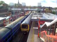 Macclesfield had two stations, this is the former Central station - rebuilt and renamed as plain Macclesfield since Hibel Road station closed in 1960. The services shown are the 08.19 to Stoke-on-Trent on the left, and the 08.19 to Manchester Piccadilly on the right - a very good service level for a Saturday morning. View south on 12 May 2012.<br><br>[Ken Strachan 12/05/2012]