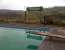 Not every disused station has a swimming pool, you know. The Southbound platform nameboard reflects on retirement on the Somerset and Dorset. View looks East by Northeast, so no Cary Grant. [See image 38866]<br><br>[Ken Strachan 06/04/2012]