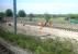 Tram tracks being laid alongside Carrick Knowe Golf Course on 21 May 2012, seen from a Fife- bound train.<br><br>[Bill Roberton 21/05/2012]