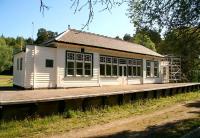 Cross-platform view of the main building at the former Knockando station (currently undergoing refurbishment) on 26 May 2012.  <br><br>[John Furnevel 26/05/2012]