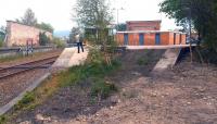 The west end of the former triangular station at Forres in May 2012. The surviving platform, serving trains on the Inverness - Aberdeen line, is straight ahead, while the remains of the west-south platform, which handled trains to and from Aviemore, is on the right. Part of the station car park currently occupies the trackbed beyond the trees.<br><br>[John Furnevel 25/05/2012]