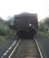 In the absence of a brake van, the NCB shunter at Comrie Colliery might resort to a brake STICK, carefully placed below the buffer beam of the last wagon! Photographed in 1974.<br><br>[Bill Roberton //1974]