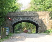 The wooden station buildings and platforms at Tissington were swept away after closure, like all the others on the line, but the station site is now a car park and picnic site on the <I>Tissington Trail</I>. This view in May 2012 looks north towards Parsley Hay and Buxton and the semaphore arm mounted on the bridge is a nice reminder of times past. <br><br>[Mark Bartlett 23/05/2012]