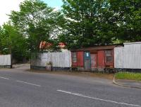 The old Esso depot at Maud in June 2012. Incorporated into the corrugated iron boundary fence is a van body, presumably used as the office. The depot is located in the V of the junction of the former lines to Fraserburgh and Peterhead immediately north of station. [See image 39084]<br><br>[Brian Taylor 01/06/2012]