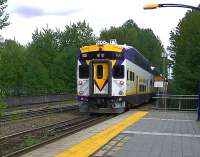 One of the 'West Coast Express' push-pull trains from Vancouver leaving Coquitlam heading for Mission on 8 May 2012. Note the array of horns - and the bell (which is used). The WCE trains run between Mission and Vancouver along the Fraser River - a journey time of around 75 minutes. [See image 39033]<br><br>[Malcolm Chattwood 08/05/2012]