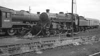 BR Standard class 4 no 75027 at Upperby in August 1967, almost eight months after the shed had closed. Contrary to appearances, the locomotive is in store, rather than dumped, and would subsequently move to Carnforth, seeing out the end of steam there in August 1968. Stanier 8F no 48400, nominally allocated to Carnforth but actually in store at 12B, also survived until the end of steam, in this case at Rose Grove shed.<br><br>[Bill Jamieson 27/08/1967]