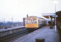 A Sheringham - Norwich DMU calls at Hoveton & Wroxham in fading light on a January afternoon in 1988.<br><br>[Ian Dinmore /01/1988]